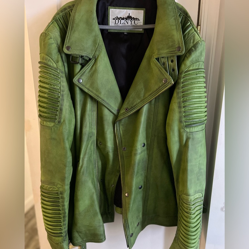 Big and tall Leather unique Biker jacket. Not true to size , fits like a 5x -6x.